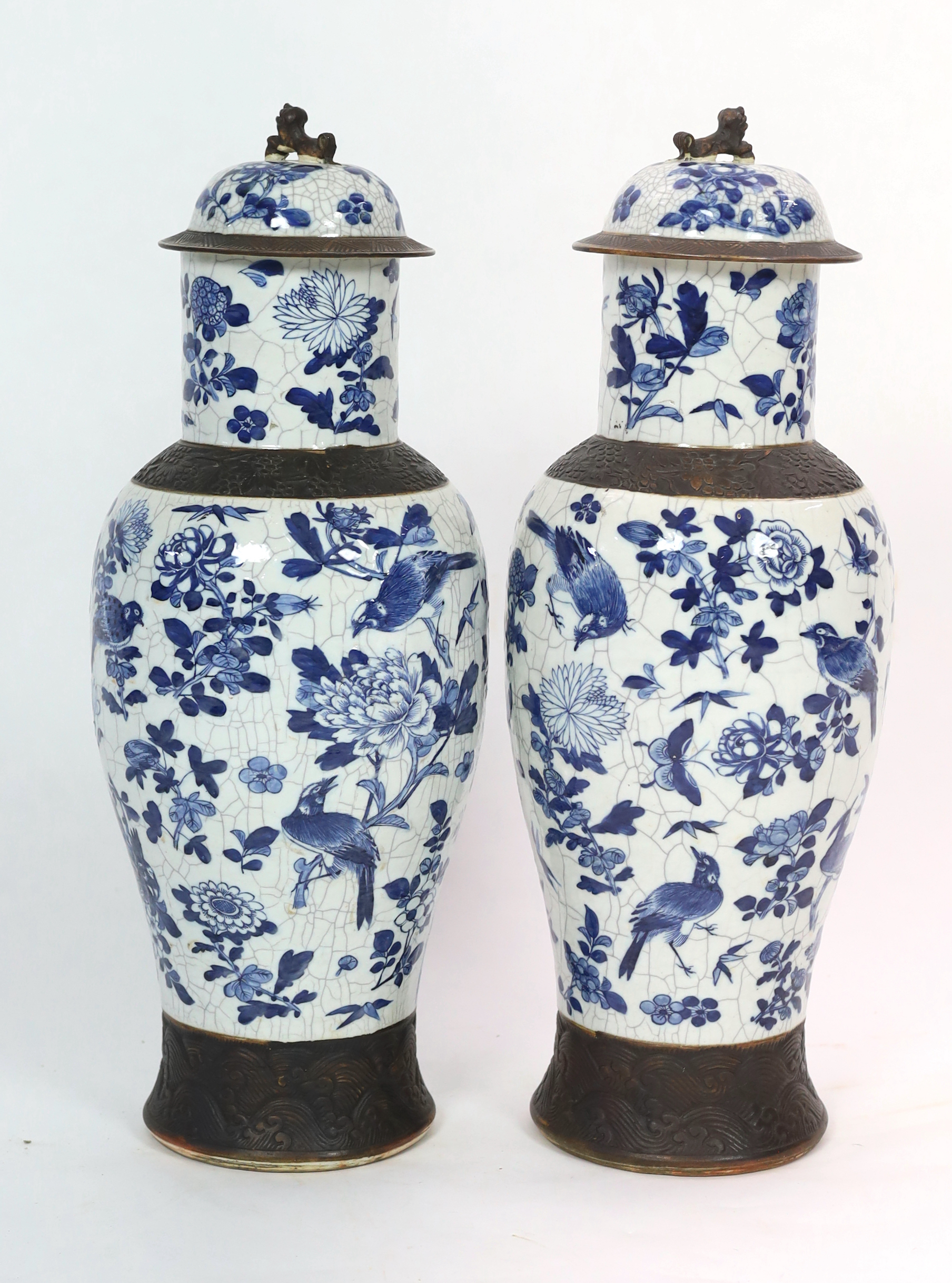 A pair of large Chinese blue and white crackle glaze vases and covers, late 19th century